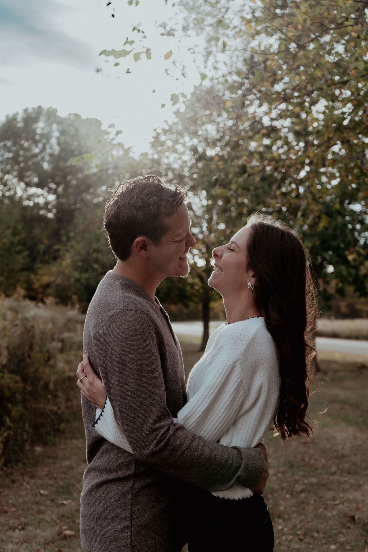 Couple laughing in autumn light